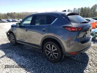 2018 Mazda CX-5 Grand Touring with VIN JM3KFADM2J1313418, listed as a Copart auction lot 49486875 with 94,930 mi miles and Salvage Title. Bid and sale history available at carsss.com. Image 2.