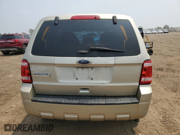 2011 Ford Escape XLS with VIN 1FMCU0C75BKC58172, listed as a Copart auction lot 60492825 with 114,518 mi miles and Salvage title. Bid and sale history available at DreamBid. Image 6.
