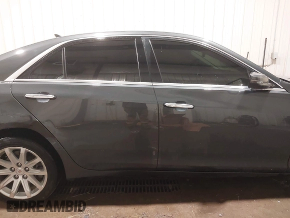 2014 Cadillac CTS Luxury AWD with VIN 1G6AX5S37E0172041, listed as a IAAI auction lot 40343343 with 102,506 mi miles and . Bid and sale history available at DreamBid. Image 13.