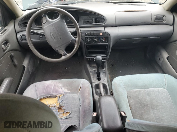 1996 Kia Sephia RS z VIN KNAFA1256T5265533, wystawiony jako Copart lot #48195555 z przebiegiem 225 062 mil mil oraz Szkoda całkowita • Salvage title. Historia ofert i sprzedaży dostępna na DreamBid. Obrazek 8.