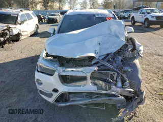 2018 BMW X1 xDrive28i with VIN WBXHT3C36J5K21286, listed as a Copart auction lot 88702365 with 0 mi miles and Salvage Title. Bid and sale history available at carsss.com. Image 5.