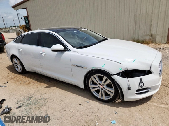 2015 Jaguar XJ Portfolio with VIN SAJWA2GZ7F8V82990, listed as a Copart auction lot 63325535 with 113,892 mi miles and Salvage title. Bid and sale history available at DreamBid. Image 4.