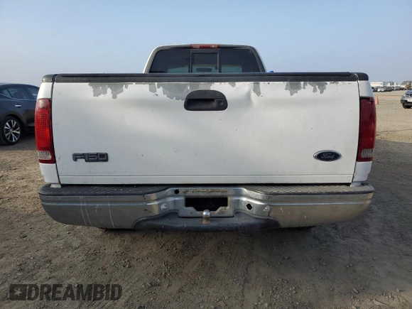 1999 Ford F-150 XL with VIN 1FTRX17L6XNA06844, listed as a Copart auction lot 83109004 with Not Provided miles and Salvage Title. Bid and sale history available at carsss.com. Image 6.