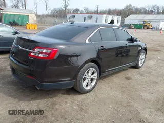 2013 Ford Taurus SEL with VIN 1FAHP2E87DG220389, listed as a IAAI auction lot 41930118 with 128,324 mi miles and . Bid and sale history available at carsss.com. Image 4.