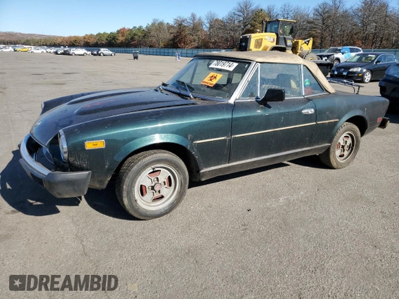 1979 FIAT 124 Spider z VIN 124CS20151060, wystawiony jako Copart lot #78019714 z przebiegiem 95 504 mil mil oraz Czysty tytuł • Clean title. Historia ofert i sprzedaży dostępna na DreamBid. Obrazek 1.