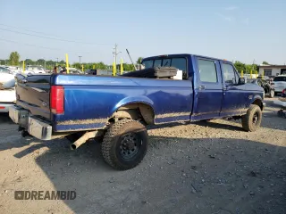 1997 Ford F-350 with VIN 1FTJW36F0VEC59307, listed as a Copart auction lot 62430515 with 199,894 mi miles and Salvage title. Bid and sale history available at DreamBid. Image 3.