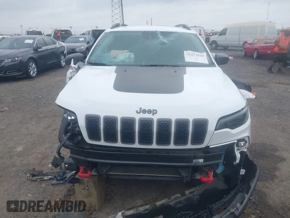2021 Jeep Cherokee Trailhawk with VIN 1C4PJMBX4MD239112, listed as a IAAI auction lot 42271040 with 62,917 mi miles and . Bid and sale history available at DreamBid. Image 13.