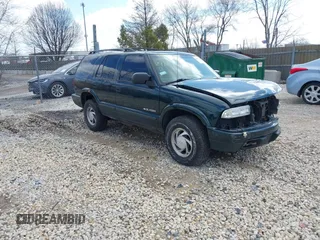 2003 Chevrolet Blazer LS z VIN 1GNDT13X93K177170, wystawiony jako IAAI lot #41839837 z przebiegiem 148 555 mil mil oraz . Historia ofert i sprzedaży dostępna na DreamBid. Obrazek 1.