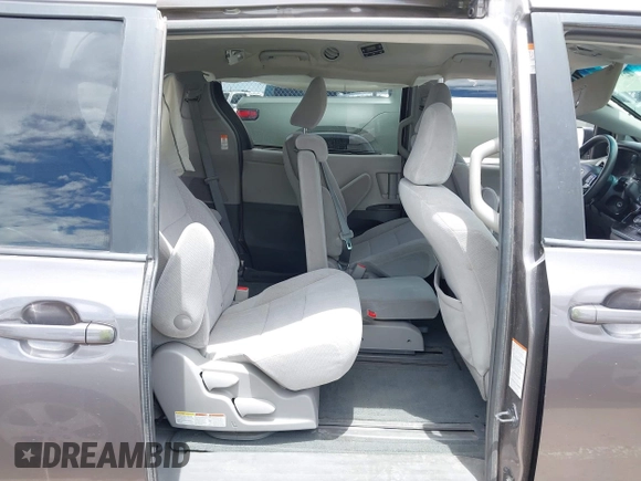 2015 Toyota Sienna LE AAS with VIN 5TDKK3DC8FS531431, listed as a IAAI auction lot 42372601 with 63,633 mi miles and . Bid and sale history available at DreamBid. Image 8.