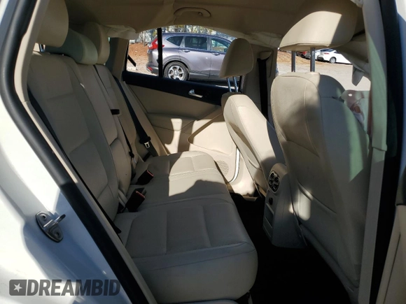2014 Volkswagen Tiguan SE z VIN WVGAV3AX1EW523157, wystawiony jako Copart lot #82111894 z przebiegiem 103 172 mil mil oraz Szkoda całkowita • Salvage title. Historia ofert i sprzedaży dostępna na DreamBid. Obrazek 11.