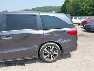 2022 Honda Odyssey Touring z VIN 5FNRL6H83NB023583, wystawiony jako IAAI lot #42425498 z przebiegiem Nie podano mil oraz . Historia ofert i sprzedaży dostępna na DreamBid. Obrazek 16.