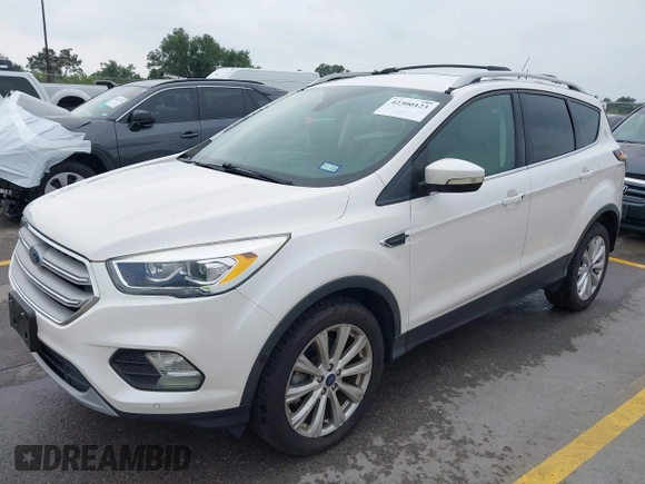 2018 Ford Escape Titanium with VIN 1FMCU9J98JUB87867, listed as a IAAI auction lot 42300123 with 48,357 mi miles and . Bid and sale history available at DreamBid. Image 17.