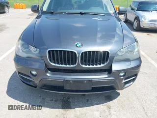2011 BMW X5 35i with VIN 5UXZV4C57BL739907, listed as a IAAI auction lot 42135572 with 0 mi miles. Bid and sale history available at carsss.com. Image 6.