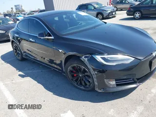 2017 Tesla Model S 100D with VIN 5YJSA1E21HF202591, listed as a IAAI auction lot 41983073 with 140,282 mi miles and . Bid and sale history available at DreamBid. Image 1.