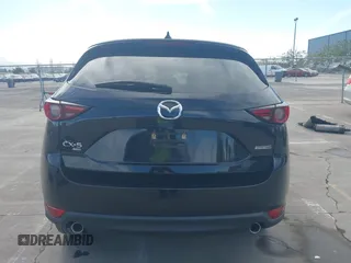 2021 Mazda CX-5 Grand Touring with VIN JM3KFBDM4M1426197, listed as a IAAI auction lot 42004644 with 43,814 mi miles. Bid and sale history available at carsss.com. Image 17.
