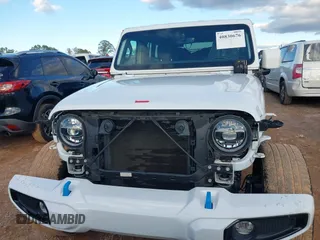 2021 Jeep Wrangler Unlimited Sahara with VIN 1C4JJXP64MW840094, listed as a IAAI auction lot 40830676 with 31,716 mi miles and . Bid and sale history available at DreamBid. Image 13.
