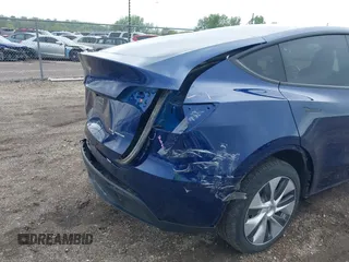 2023 Tesla Model Y Long Range z VIN 7SAYGDEE0PF840787, wystawiony jako IAAI lot #42172489 z przebiegiem 16 314 mil mil oraz . Historia ofert i sprzedaży dostępna na DreamBid. Obrazek 21.