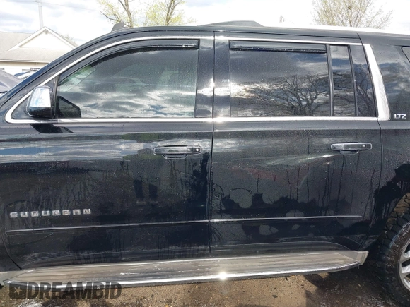 2015 Chevrolet Suburban LTZ with VIN 1GNSKKKC5FR255373, listed as a IAAI auction lot 42012528 with 219,030 mi miles and . Bid and sale history available at DreamBid. Image 14.