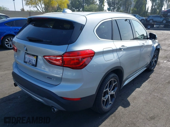 2019 BMW X1 xDrive28i with VIN WBXHT3C56K5L38658, listed as a IAAI auction lot 42496734 with 49,373 mi miles and . Bid and sale history available at DreamBid. Image 4.