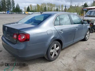 2009 Volkswagen Jetta Sedan SE with VIN 3VWRM71K59M069259, listed as a IAAI auction lot 41818850 with 164,157 mi miles. Bid and sale history available at carsss.com. Image 4.