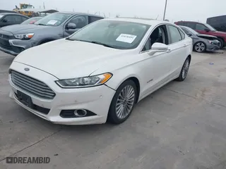 2014 Ford Fusion Titanium Hybrid with VIN 3FA6P0RU6ER115985, listed as a IAAI auction lot 41870494 with 132,321 mi miles. Bid and sale history available at carsss.com. Image 2.