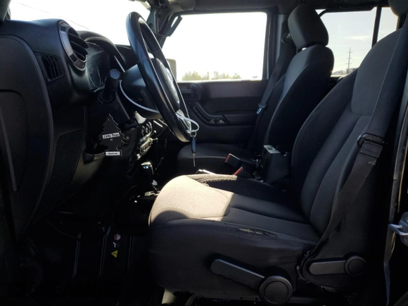 2014 Jeep Wrangler Unlimited Sport with VIN 1C4BJWDG1EL308834, listed as a Copart auction lot 53710065 with 127,612 mi miles and Clean Title. Bid and sale history available at DreamBid. Image 7.