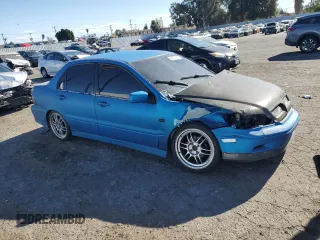 2002 Mitsubishi Lancer OZ-Rally with VIN JA3AJ86E62U070034, listed as a Copart auction lot 86914144 with 180,675 mi miles and Salvage Title. Bid and sale history available at carsss.com. Image 4.