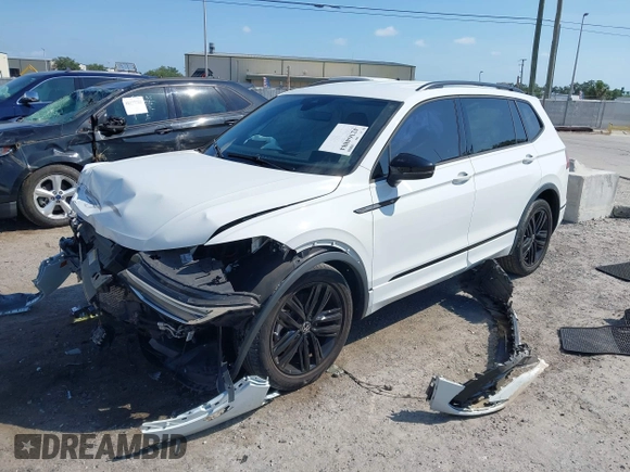 2022 Volkswagen Tiguan SE R-Line Black with VIN 3VVCB7AX5NM009696, listed as a IAAI auction lot 42364884 with 45,380 mi miles and . Bid and sale history available at DreamBid. Image 2.