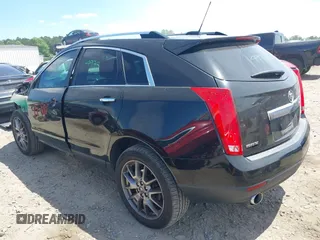 2015 Cadillac SRX Performance Collection z VIN 3GYFNCE30FS549872, wystawiony jako IAAI lot #42201529 z przebiegiem 125 128 mil mil oraz . Historia ofert i sprzedaży dostępna na DreamBid. Obrazek 3.