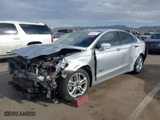 2016 Ford Fusion Energi Titanium with VIN 3FA6P0SU6GR144898, listed as a IAAI auction lot 41912557 with 173,415 mi miles. Bid and sale history available at carsss.com. Image 2.