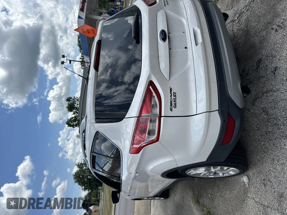 2013 Ford Escape Titanium with VIN 1FMCU9J95DUB21698, listed as a IAAI auction lot 42694998 with 170,593 mi miles and . Bid and sale history available at DreamBid. Image 3.