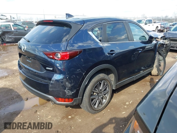 2018 Mazda CX-5 Touring with VIN JM3KFBCM5J0369799, listed as a IAAI auction lot 41895364 with 76,801 mi miles and . Bid and sale history available at carsss.com. Image 4.