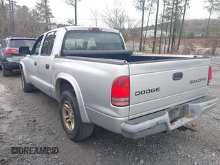 2003 Dodge Dakota z VIN 1D7HL38Z83S184469, wystawiony jako IAAI lot #41714931 z przebiegiem 194 373 mil mil oraz . Historia ofert i sprzedaży dostępna na DreamBid. Obrazek 3.