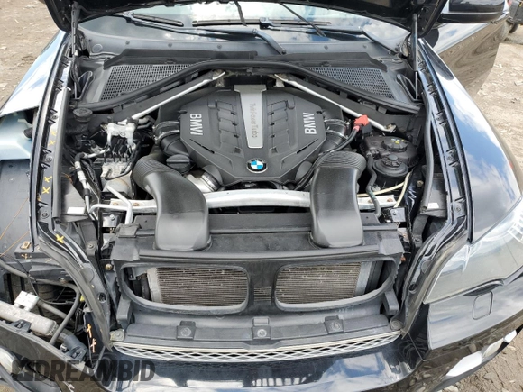 2012 BMW X6 50i z VIN 5UXFG8C51CLZ97393, wystawiony jako Copart lot #58407285 z przebiegiem 128 040 mil mil oraz Szkoda całkowita • Salvage title. Historia ofert i sprzedaży dostępna na DreamBid. Obrazek 12.