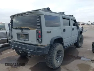 2003 Hummer H2 with VIN 5GRGN23U13H128617, listed as a IAAI auction lot 41494349 with 135,295 mi miles. Bid and sale history available at carsss.com. Image 4.
