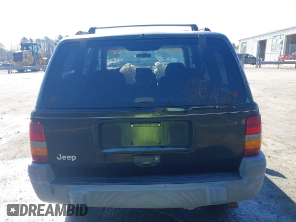 1996 Jeep Grand Cherokee Laredo with VIN 1J4GZ58S9TC268615, listed as a IAAI auction lot 41527984 with 248,443 mi miles. Bid and sale history available at carsss.com. Image 16.