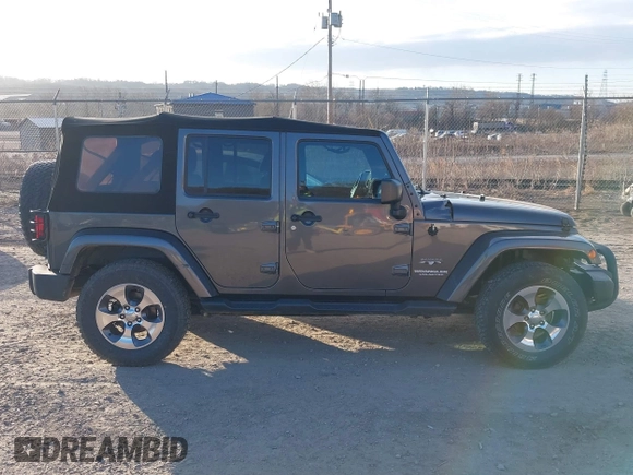2017 Jeep Wrangler Unlimited Sahara with VIN 1C4BJWEG9HL507908, listed as a IAAI auction lot 41880209 with 99,773 mi miles. Bid and sale history available at carsss.com. Image 13.
