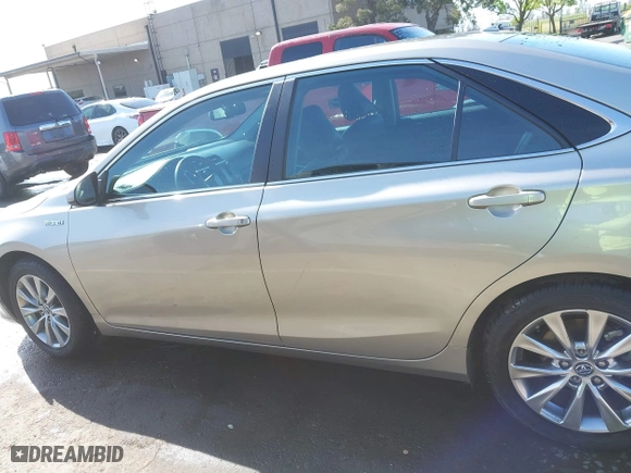 2015 Toyota Camry Hybrid LE with VIN 4T1BD1FK1FU174975, listed as a IAAI auction lot 42085034 with 54,728 mi miles. Bid and sale history available at carsss.com. Image 15.