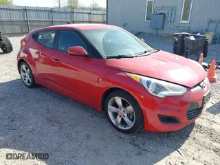 2014 Hyundai Veloster with VIN KMHTC6AD2EU214847, listed as a IAAI auction lot 42067728 with 77,421 mi miles. Bid and sale history available at carsss.com. Image 1.