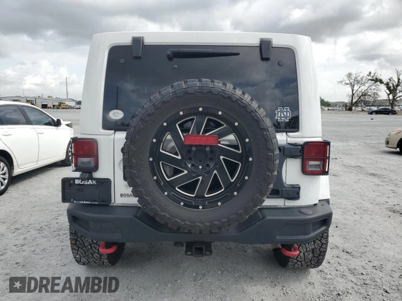 2017 Jeep Wrangler Unlimited Rubicon z VIN 1C4HJWFG6HL692928, wystawiony jako Copart lot #60049775 z przebiegiem 145 033 mil mil oraz Nie do naprawy • Non repairable. Historia ofert i sprzedaży dostępna na DreamBid. Obrazek 6.