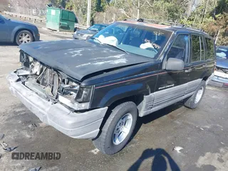 1996 Jeep Grand Cherokee Laredo with VIN 1J4GZ58S9TC268615, listed as a IAAI auction lot 41527984 with 248,443 mi miles. Bid and sale history available at carsss.com. Image 17.