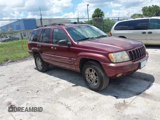 2000 Jeep Grand Cherokee Laredo with VIN 1J4G258S4YC381030, listed as a IAAI auction lot 42541918 with 306,934 mi miles and . Bid and sale history available at DreamBid. Image 1.