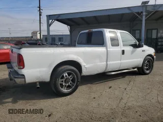 2001 Ford Super Duty F-250 XL with VIN 1FTNX20LX1EA37939, listed as a Copart auction lot 82408314 with 303,527 mi miles and Salvage Title. Bid and sale history available at carsss.com. Image 3.