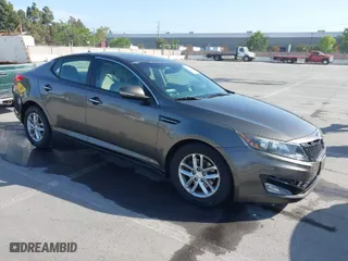 2013 Kia Optima LX with VIN 5XXGM4A79DG121930, listed as a IAAI auction lot 42103290 with 141,443 mi miles. Bid and sale history available at carsss.com. Image 1.
