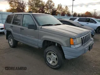 1997 Jeep Grand Cherokee Laredo with VIN 1J4GZ58S1VC741586, listed as a Copart auction lot 77619394 with 0 mi miles and Clean Title. Bid and sale history available at carsss.com. Image 4.