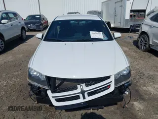 2013 Dodge Avenger SXT with VIN 1C3CDZCG2DN508594, listed as a IAAI auction lot 41771945 with 104,924 mi miles and . Bid and sale history available at DreamBid. Image 10.