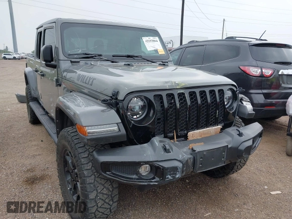 2022 Jeep Gladiator Texas Trail z VIN 1C6HJTAG2NL176011, wystawiony jako IAAI lot #42193864 z przebiegiem 27 219 mil mil oraz . Historia ofert i sprzedaży dostępna na DreamBid. Obrazek 1.