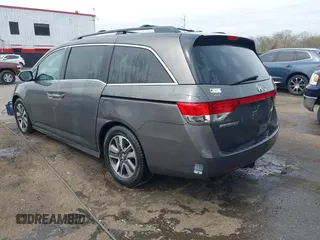 2014 Honda Odyssey Touring with VIN 5FNRL5H94EB020257, listed as a IAAI auction lot 41924245 with 204,526 mi miles and . Bid and sale history available at DreamBid. Image 3.