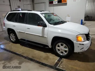 2005 GMC Envoy SLE with VIN 1GKDT13S452315816, listed as a Copart auction lot 52863805 with 128,922 mi miles and Salvage Title. Bid and sale history available at carsss.com. Image 4.