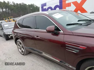 2021 Genesis GV80 with VIN KMUHCESC1MU031056, listed as a IAAI auction lot 41178354 with 95,749 mi miles and . Bid and sale history available at DreamBid. Image 12.